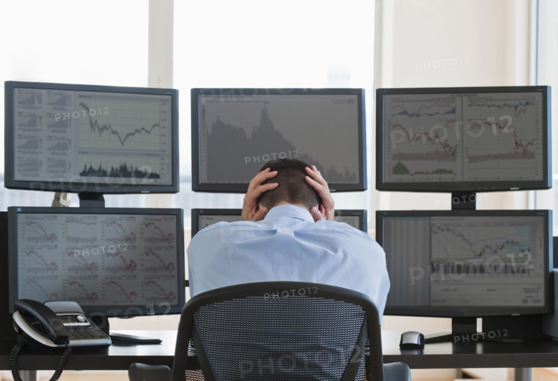 Frustrated male trader at work.