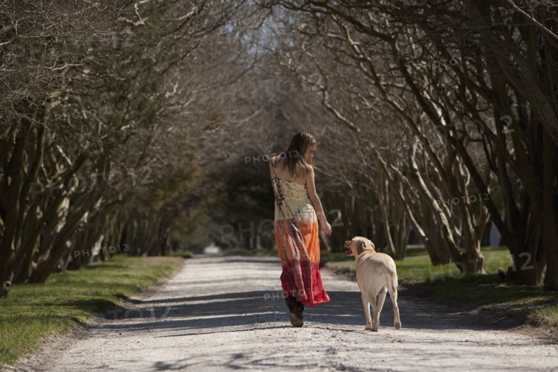 Woman walking dog