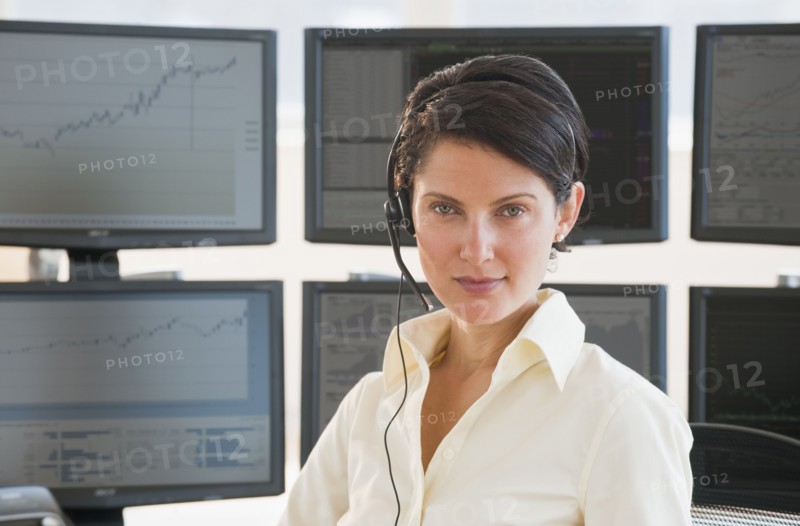 Female trader looking at camera.