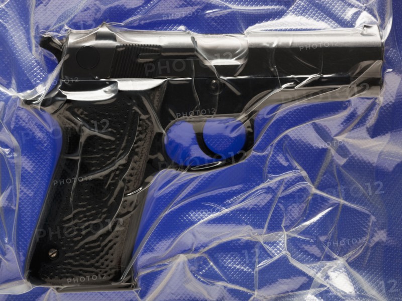 Shrink wrapped hand gun