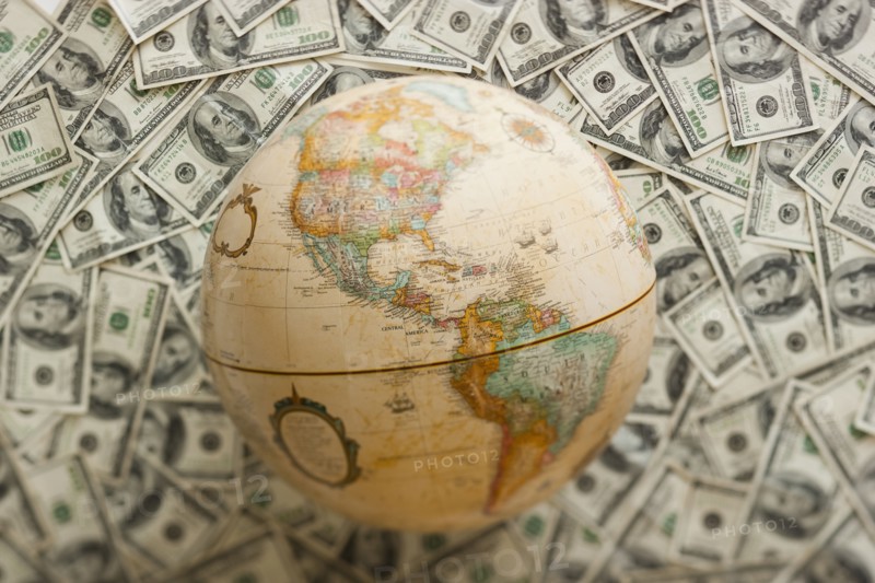 Globe on US dollars background