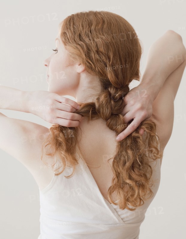 Woman fixing hair