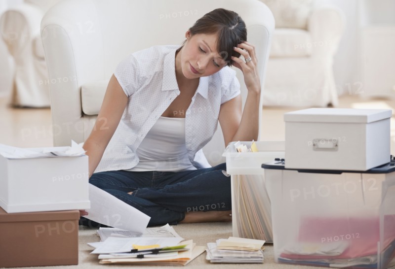Woman organizing papers.