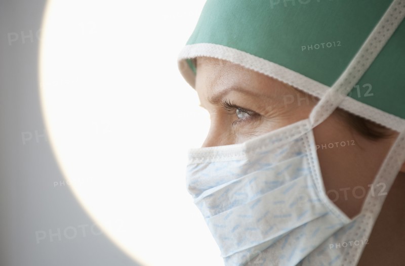 Female doctor with surgical mask.
