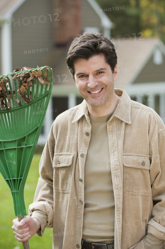 Man holding rake.