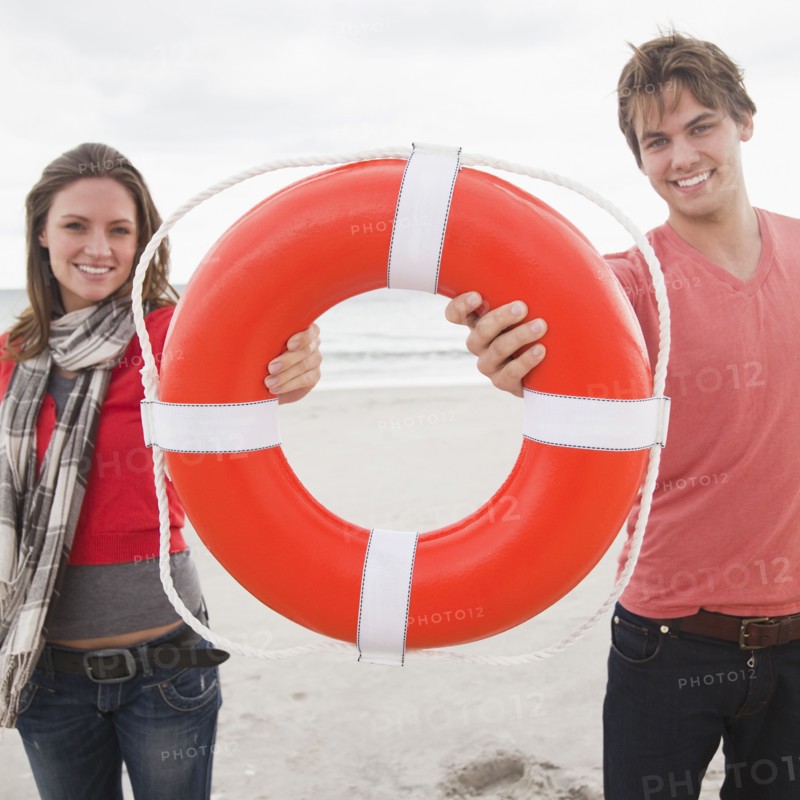 Couple holding life ring