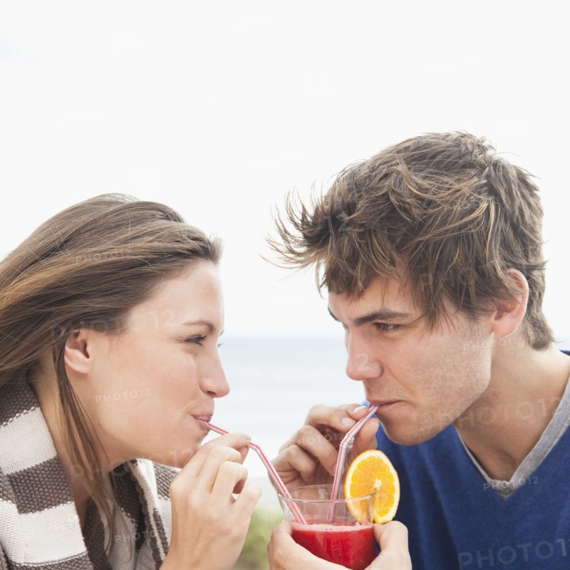 Couple sharing drink