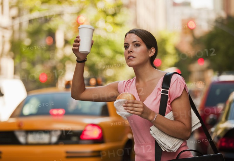 Woman hailing cab