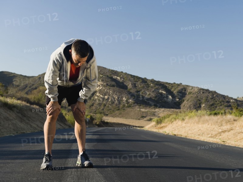 Male jogger resting