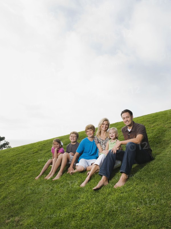 Family sitting on grass