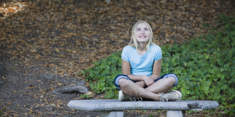 Young girl sitting on bench