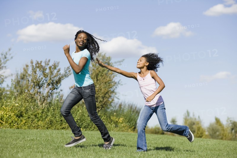 Woman and girl running