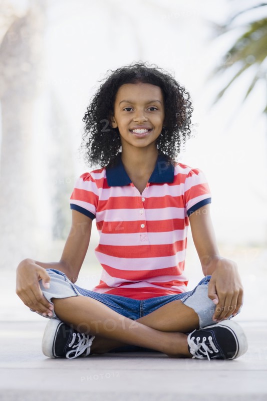 Girl sitting cross legged