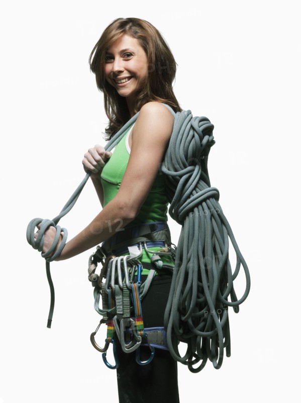 Portrait of a woman with climbing gear