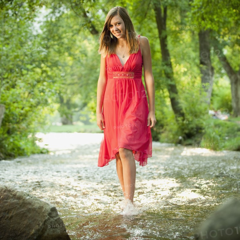 Portrait of woman walking in river