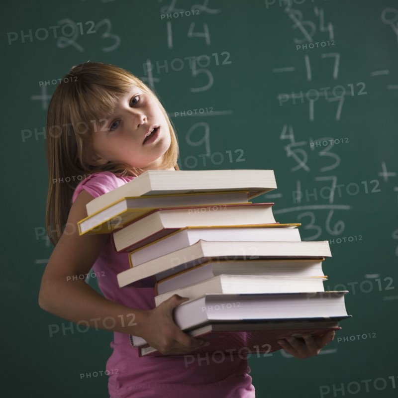 Young student holding books