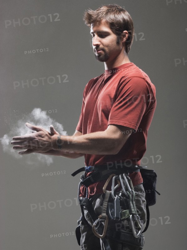 Climber putting chalk on hands