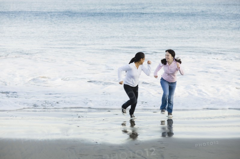 Girls running on beach