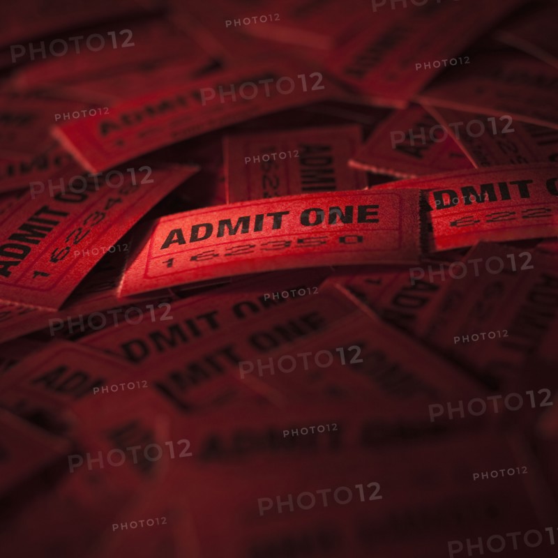Pile of red admit one tickets