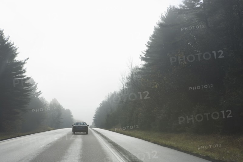 Car driving on rural road
