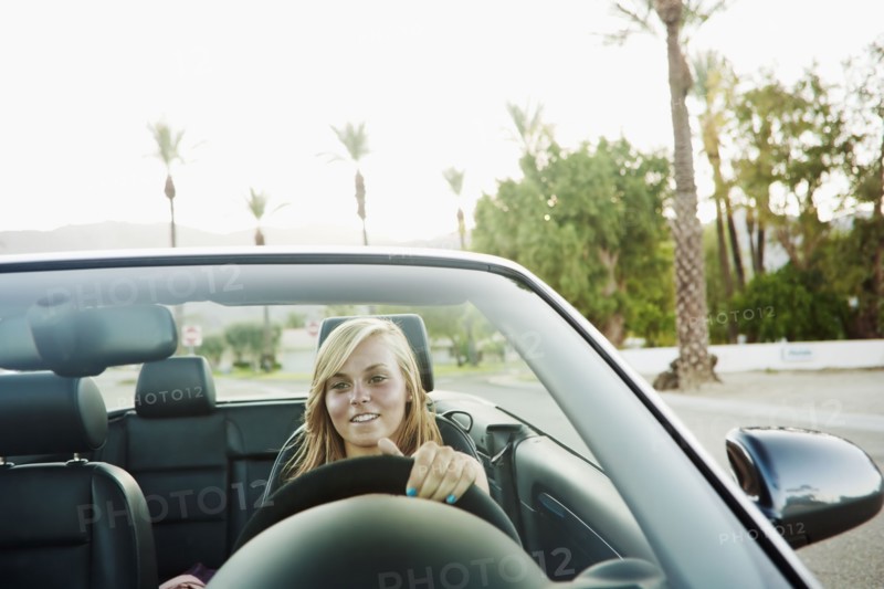 Woman driving convertible