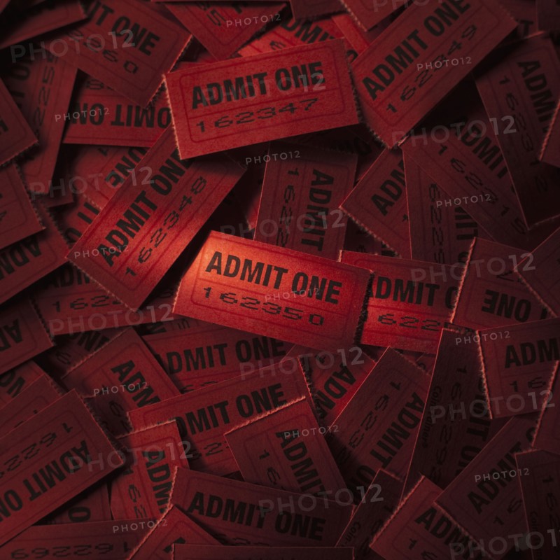 Pile of red admit one tickets