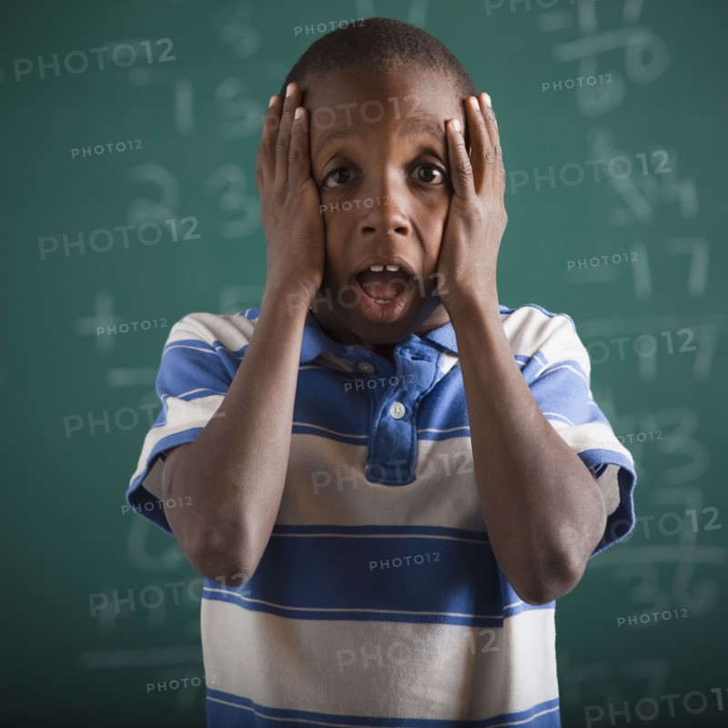 Student in front of chalkboard