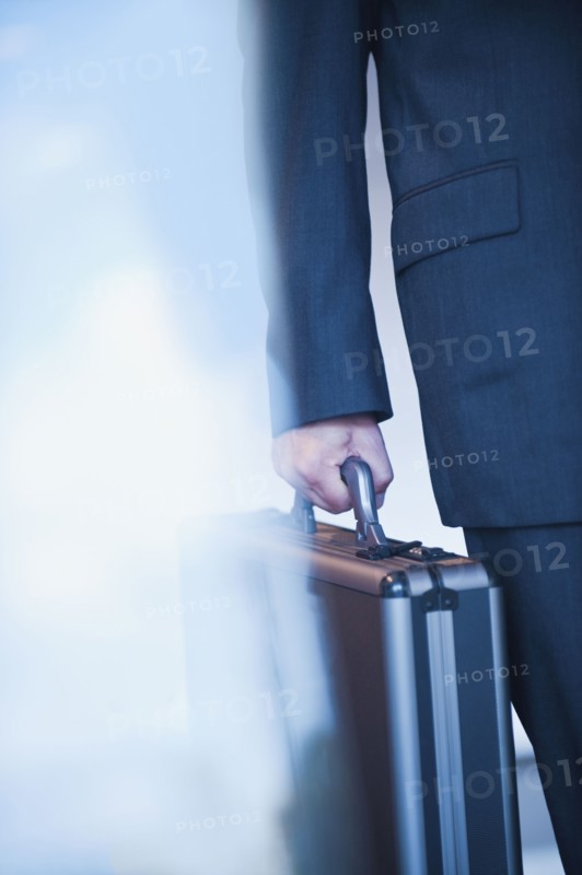 Businessman holding briefcase.