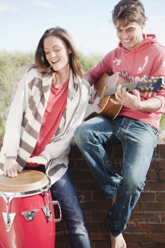 Couple playing instruments