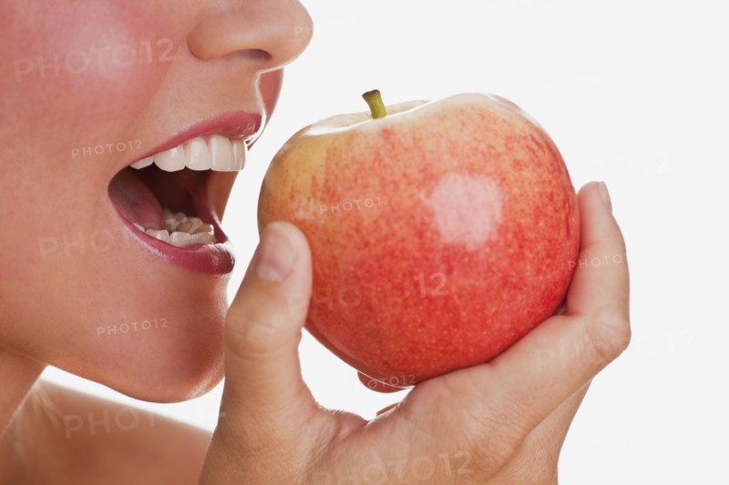 Woman eating apple