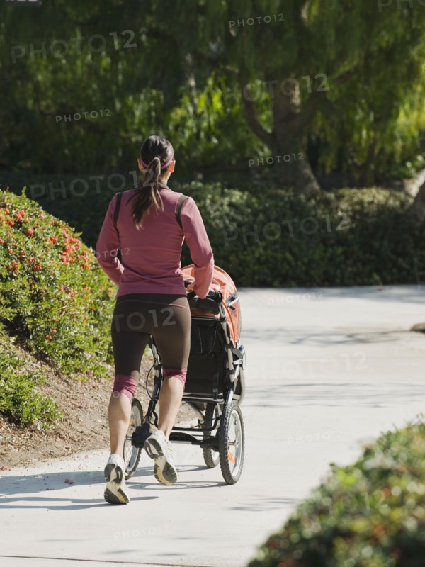 Woman jogging with stroller