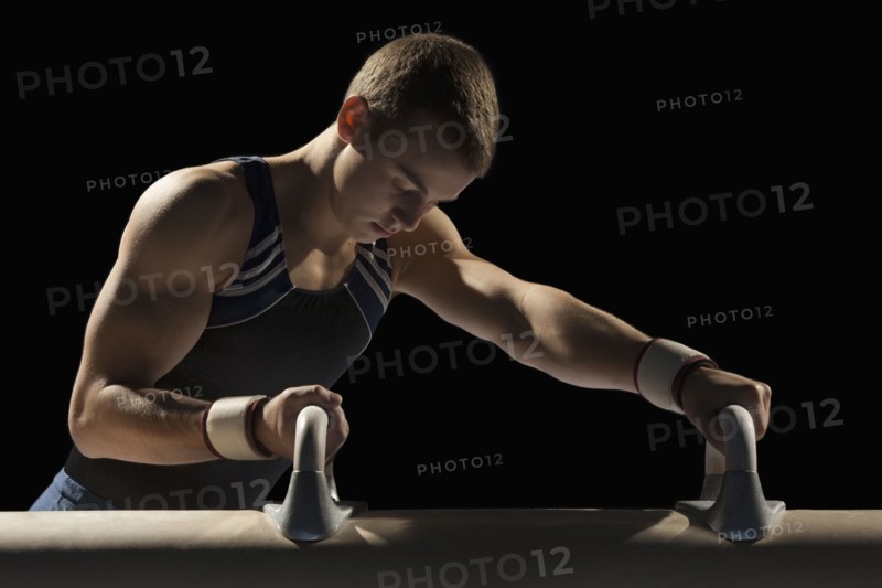 Male gymnast stretching
