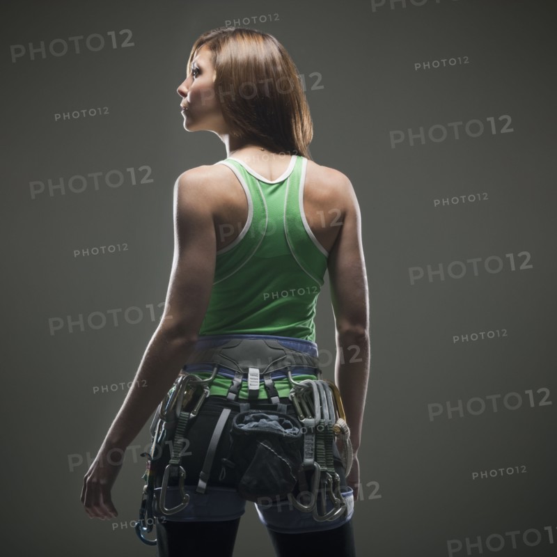 Back view of woman with climbing gear