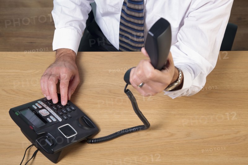 Man dialing phone