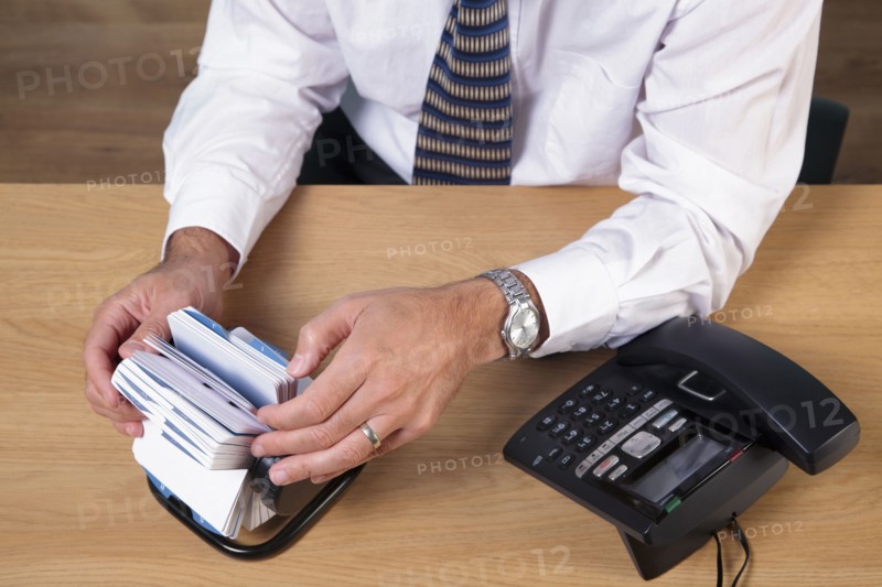 Man looking up phone number