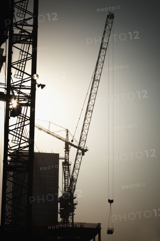 Cranes and high-rise building under construction