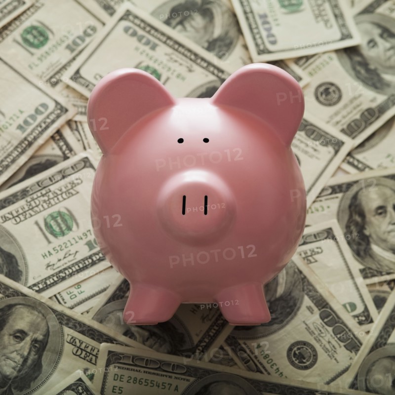 Piggy Bank on top of American currency