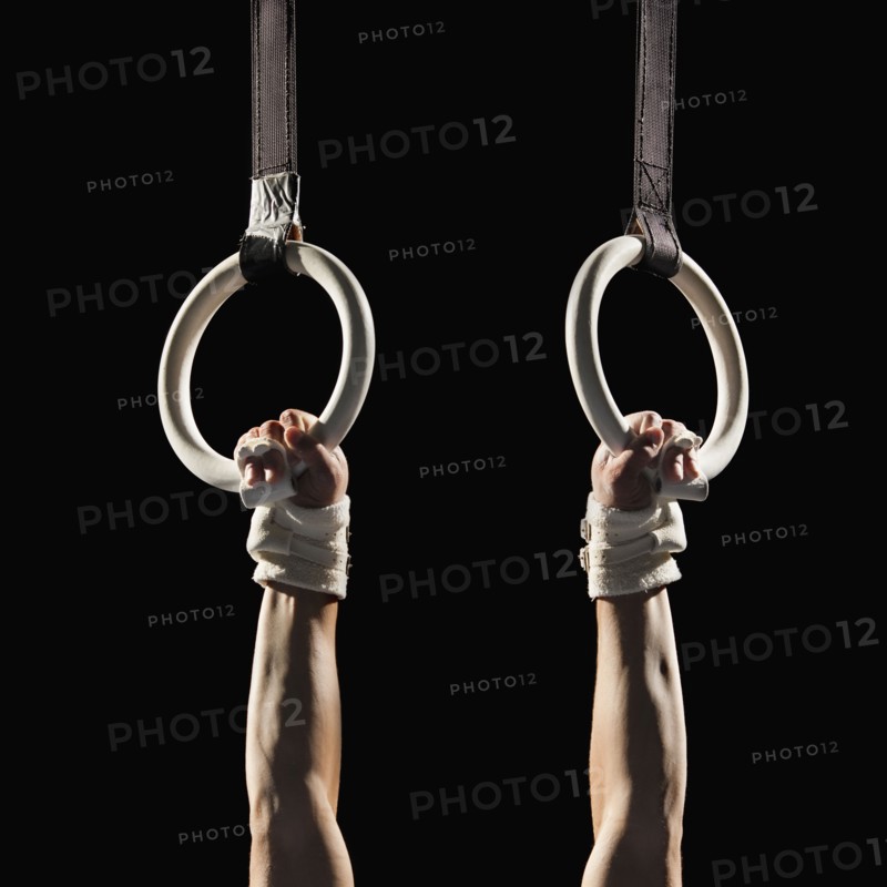 Gymnast swinging from rings