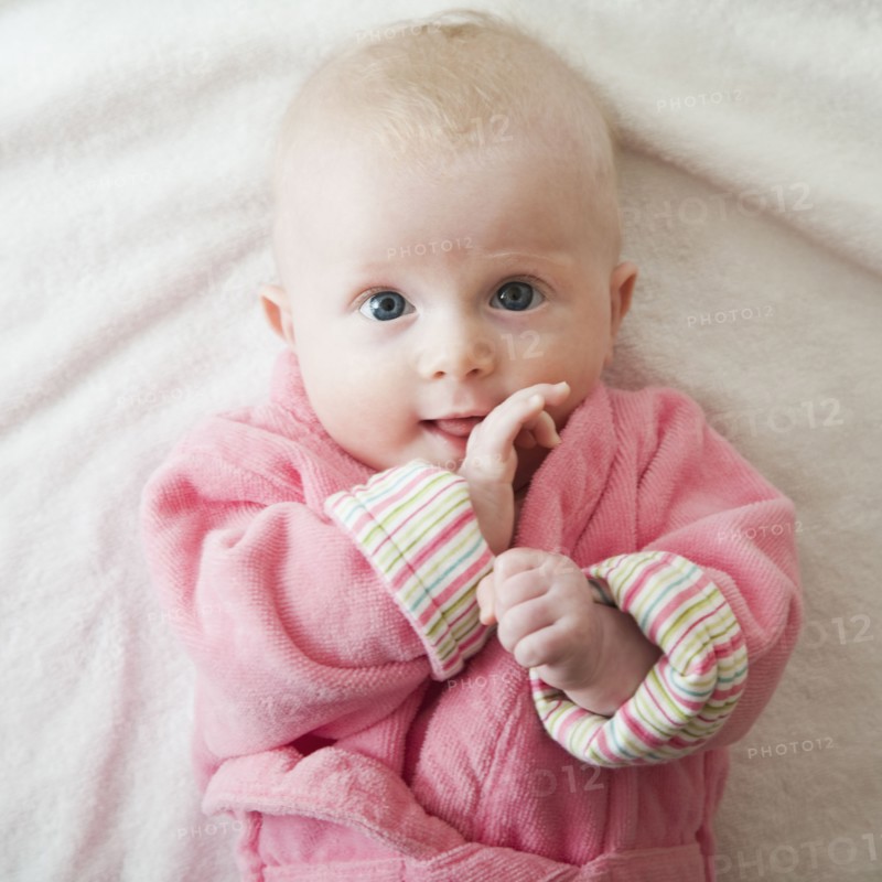 Portrait of baby girl in pink robe