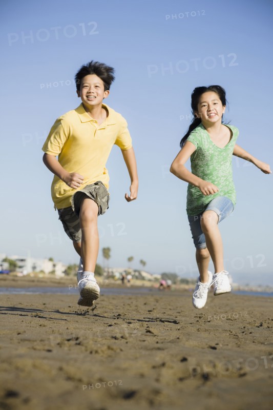 Children running on beach