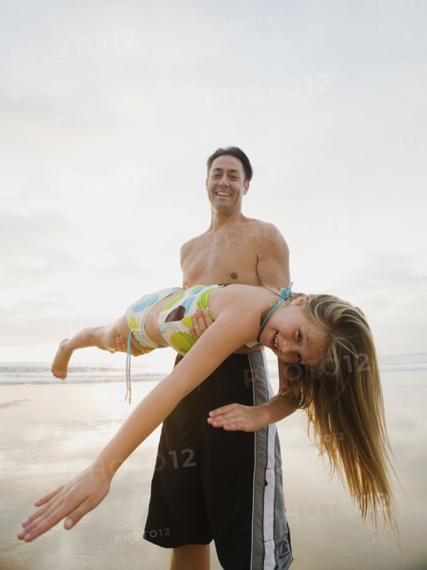 Man holding girl