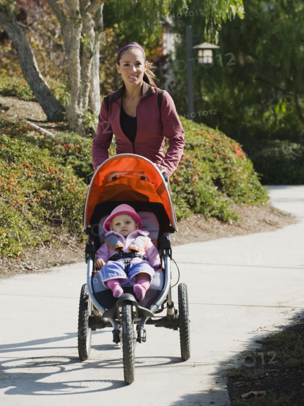 Woman jogging with stroller
