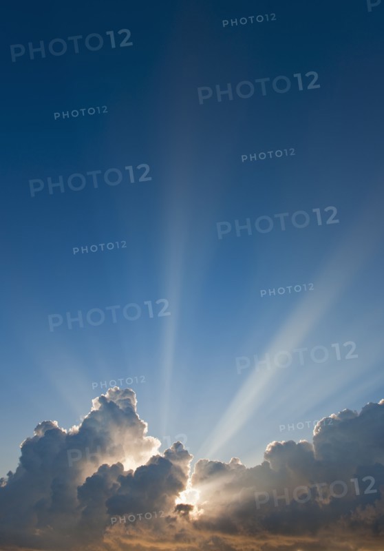 Sunset behind clouds.