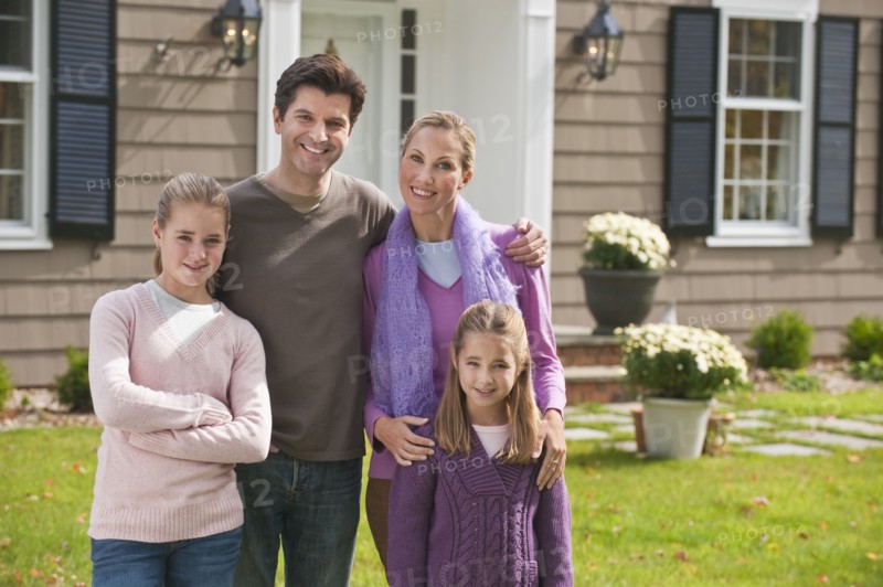 Family in front of house.