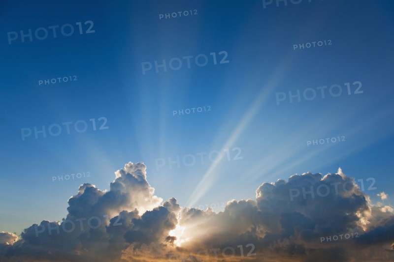 Sunset behind clouds.