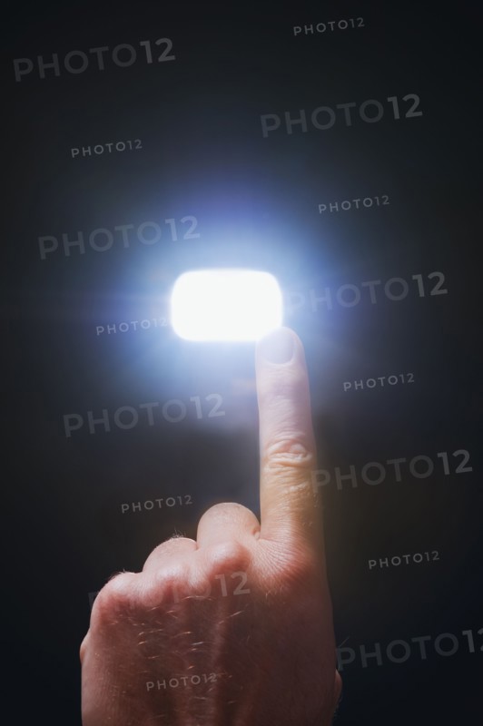 Finger pointing at light.