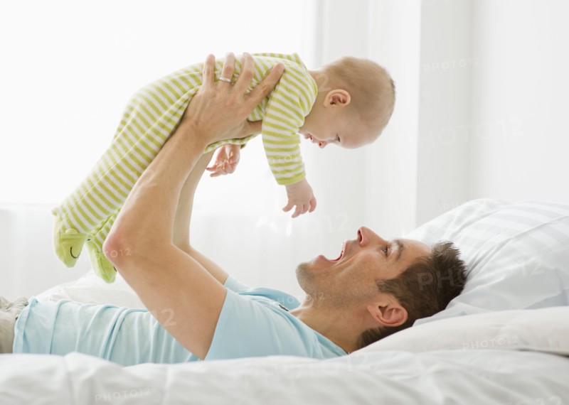 Father and baby playing.