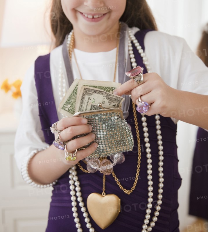 Young girl playing dress-up. Photographer: Jamie Grill