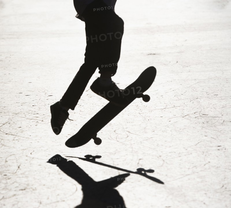 Silhouette of skateboarder. Photographer: fotog