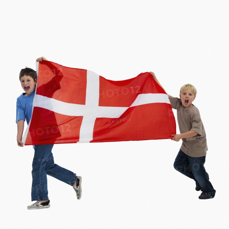 Children carrying flag. Photographer: momentimages